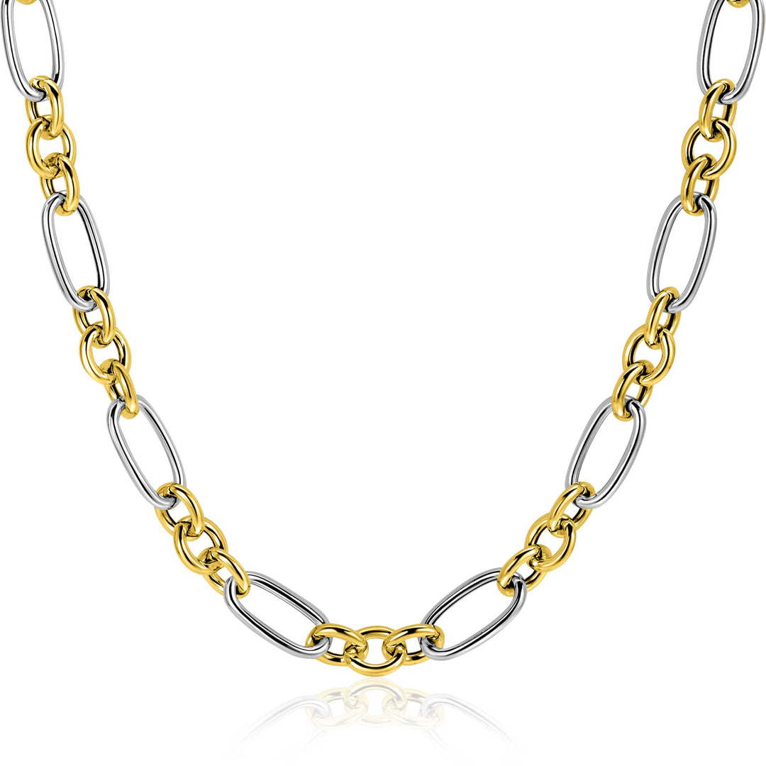 De Zinzi ketting ZIC2667 45cm toont afwisselend grote gouden en zilveren ovale schakels van het merk Zinzi, elegant weergegeven op een witte achtergrond.