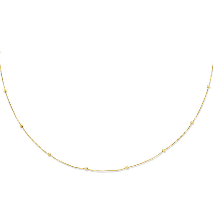 Stijlvol gepresenteerd: Van der Kooij Collectie collier bolletjes gediamanteerd 0,5 mm van 14K geelgoud (42-45 cm) met kleine gouden kraaltjes, mooi verdeeld over de lengte op een witte achtergrond.