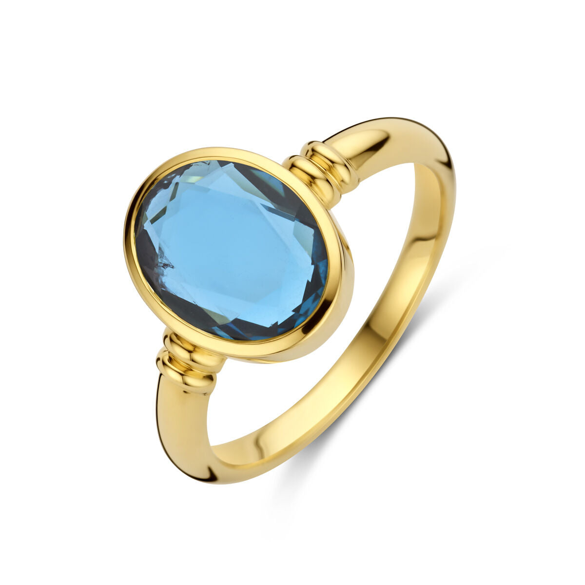 pierścionek z london blue topazem w 14K żółtym złocie z owalnym kamieniem.