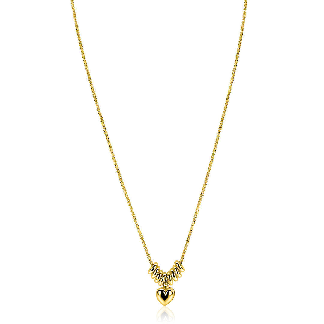 De Zinzi ketting ZIC2760 is een vergulde ketting van Zinzi, met vijf zilveren spiraalkralen en een gouden hartjeshanger met een zwarte V. Tegen een effen witte achtergrond is hij ideaal voor liefhebbers van subtiele hartjes kettingen.