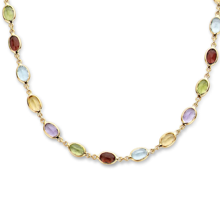 De Van der Kooij Collectie Gouden dames ketting natuurlijke kleurstenen 14K heeft bezel-set ovale edelstenen in rood, groen, blauw, geel en paars voor een luxe uitstraling die levendige kleur toevoegt aan elke outfit.
