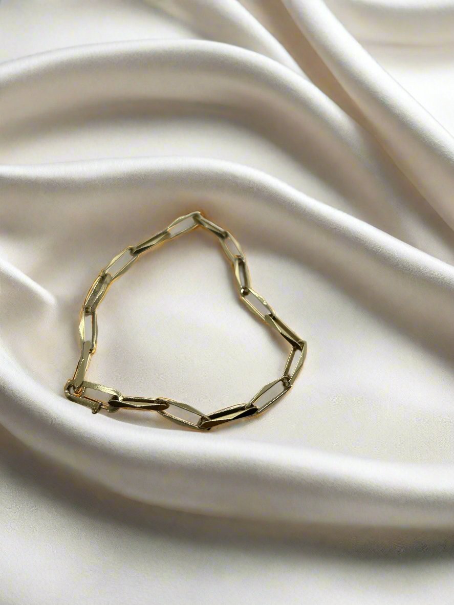 Złota bransoletka vintage 14k o masie 7,4 g, składająca się z prostokątnych ogniw.