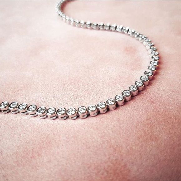 Bransoletka tenisowa z białego złota z 69 diamentami – 1.02 crt, 14 karat