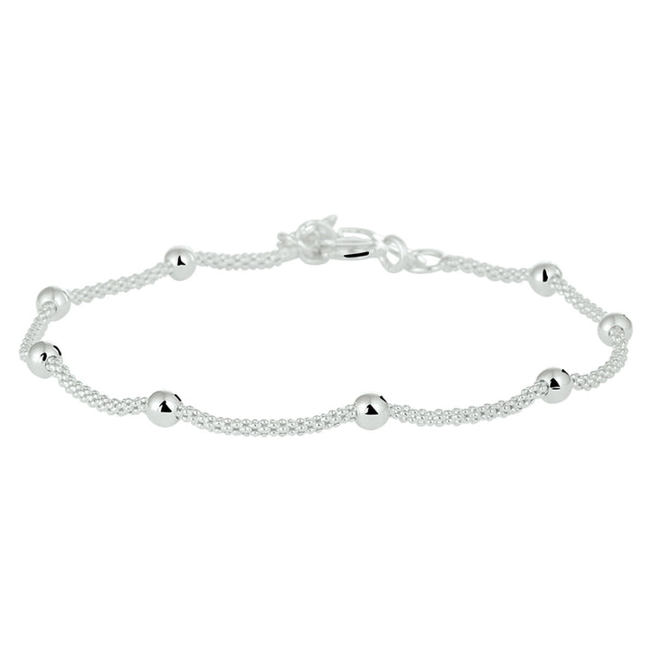 Zilveren armband met bolletjes schakel