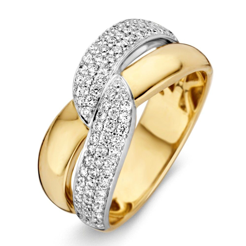 Bicolor pierścionek z żółtego i białego złota, ozdobiony diamentami o łącznej masie 0,61 ct.