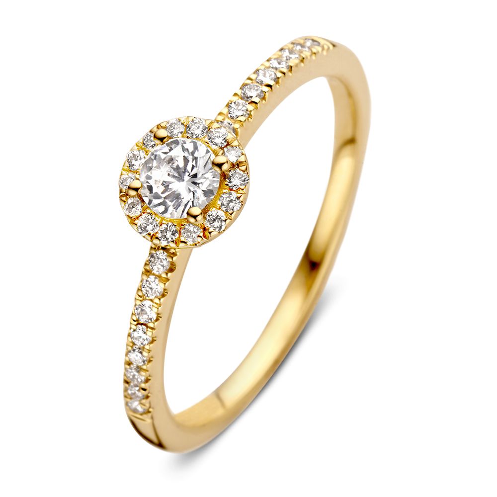 Elegancki pierścionek z żółtego złota z diamentem 0,20 ct i halo z diamentów.