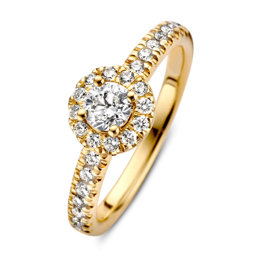 Elegancki pierścionek z żółtego złota z diamentem o masie 0,62 ct i okrągłym wzorem.