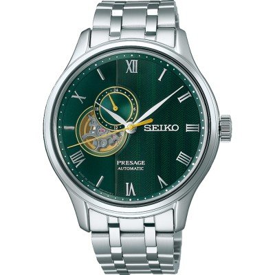 Zielony zegarek Seiko Presage z automatycznym mechanizmem, srebrna koperta i bransoleta, rzymskie cyfry.