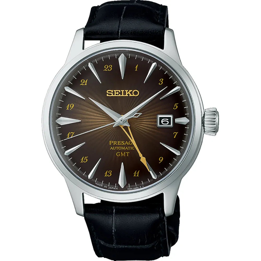 Heren horloge met een bruine wijzerplaat, zilveren kast, en zwarte leren band.
