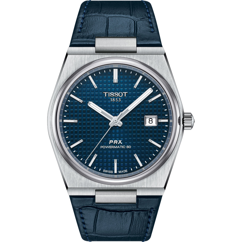 Zegarek Tissot PRX Powermatic 80 z niebieską tarczą, stalową kopertą i skórzanym paskiem.