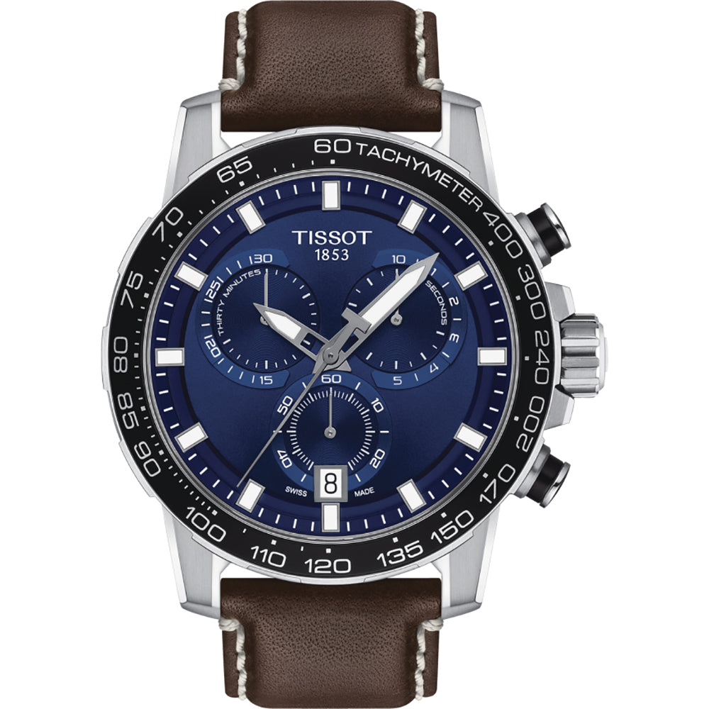 Zegarek Tissot Supersport Chrono z niebieską tarczą, stalową kopertą i brązowym skórzanym paskiem.