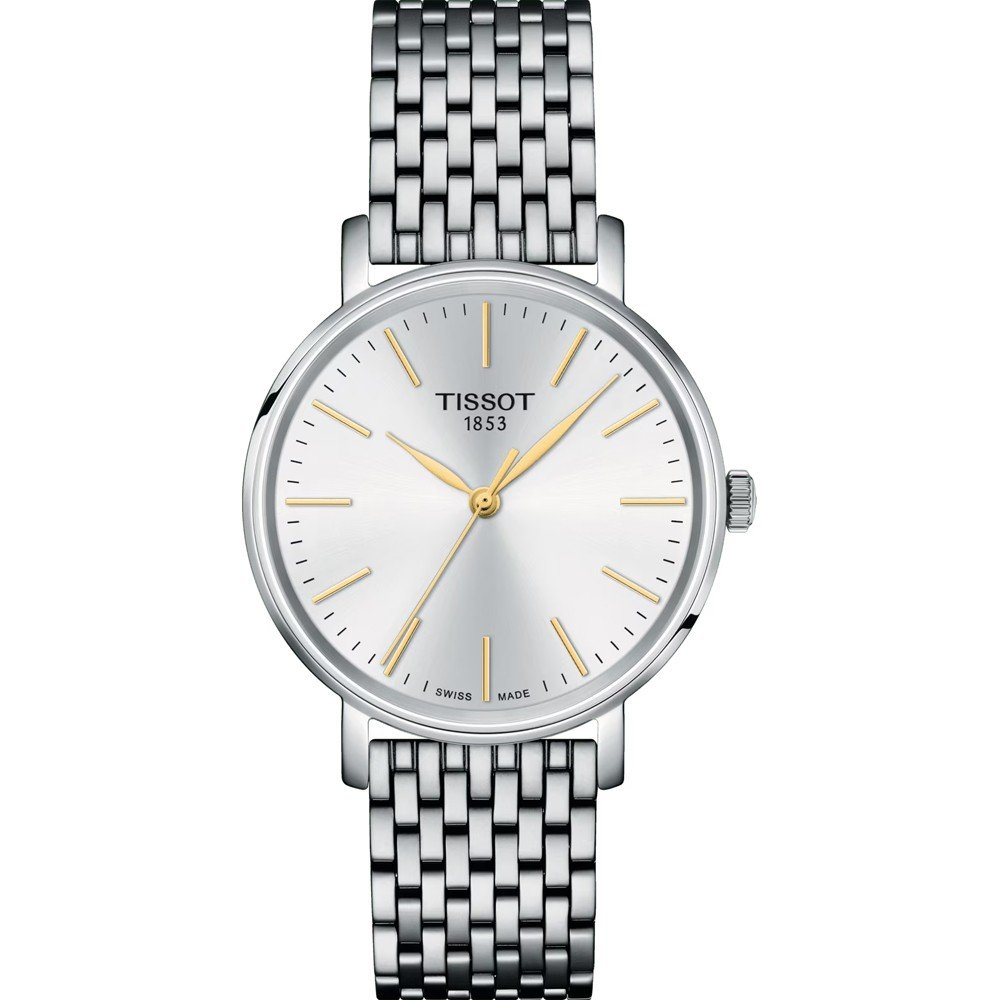 Srebrny zegarek Tissot z 34 mm tarczą, złotymi wskazówkami i metalową bransoletą.