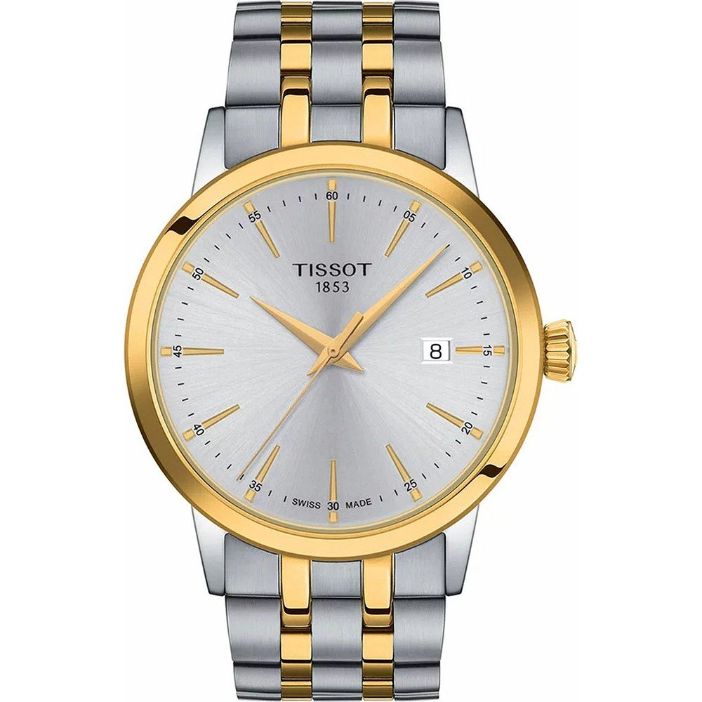 Zegarek Tissot Classic Dream z srebrną tarczą, złotymi akcentami i metalową bransoletą w kolorze srebrnym i złotym.