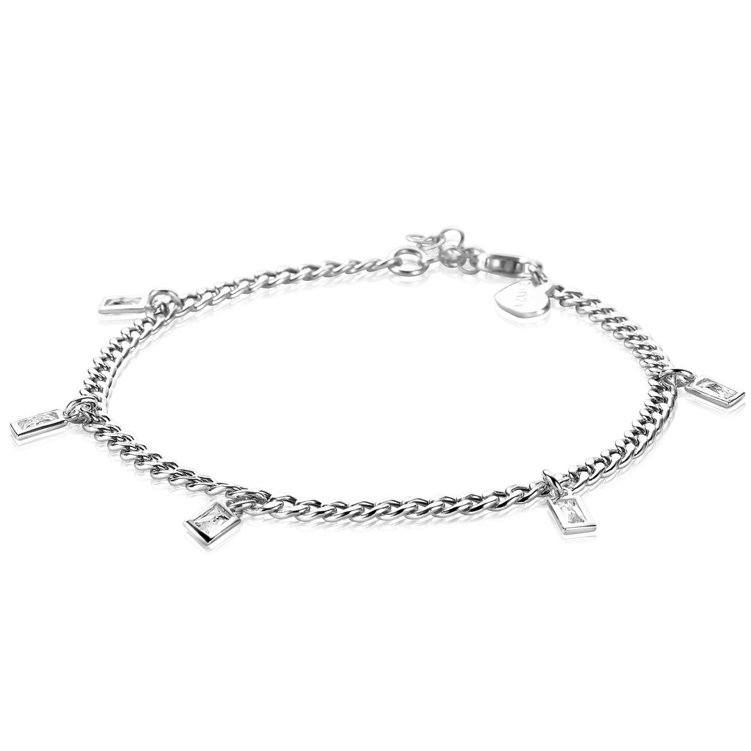 De Zinzi Armband Zilver Zia2104 is een delicate zilveren armband met kleine rechthoekige bedels langs de dubbele kettingstructuur met karabijnsluiting. Het eenvoudige en elegante ontwerp is perfect voor liefhebbers van minimalistische sieraden.